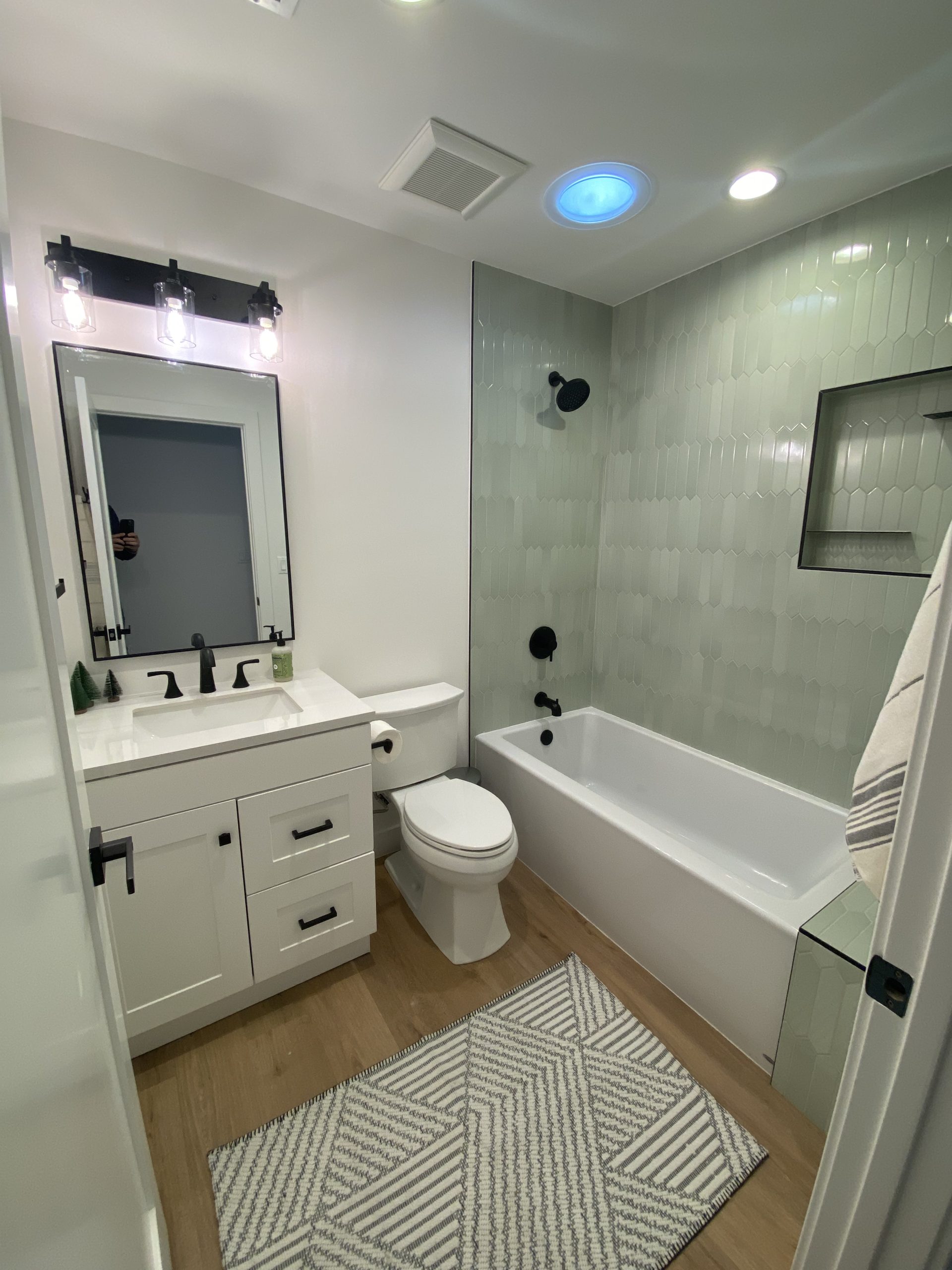 Small bathroom remodel designed for space efficiency, updated fixtures, and improved lighting