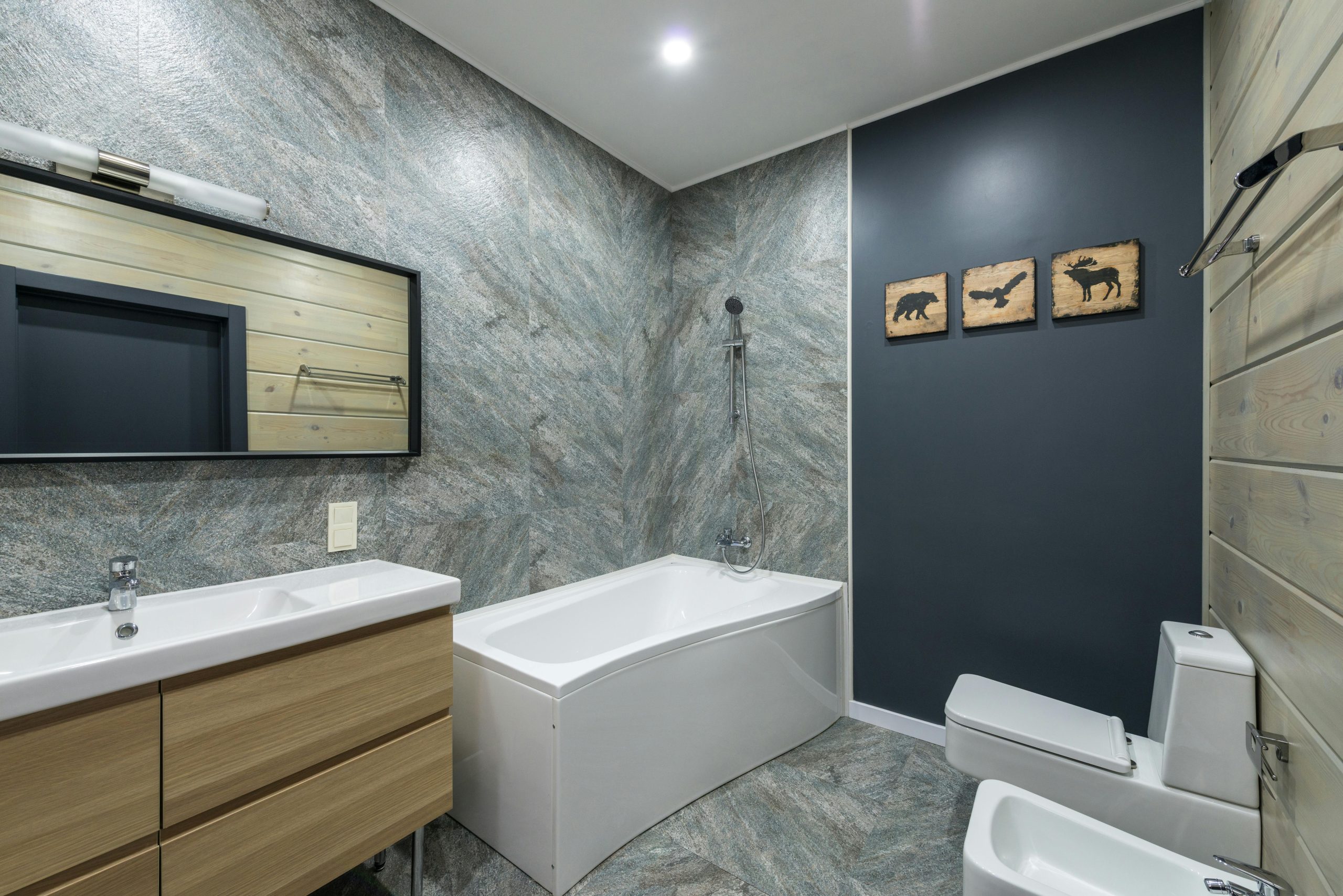 Contemporary bathroom remodel highlighting modern plumbing fixtures, neutral tones, and luxury details