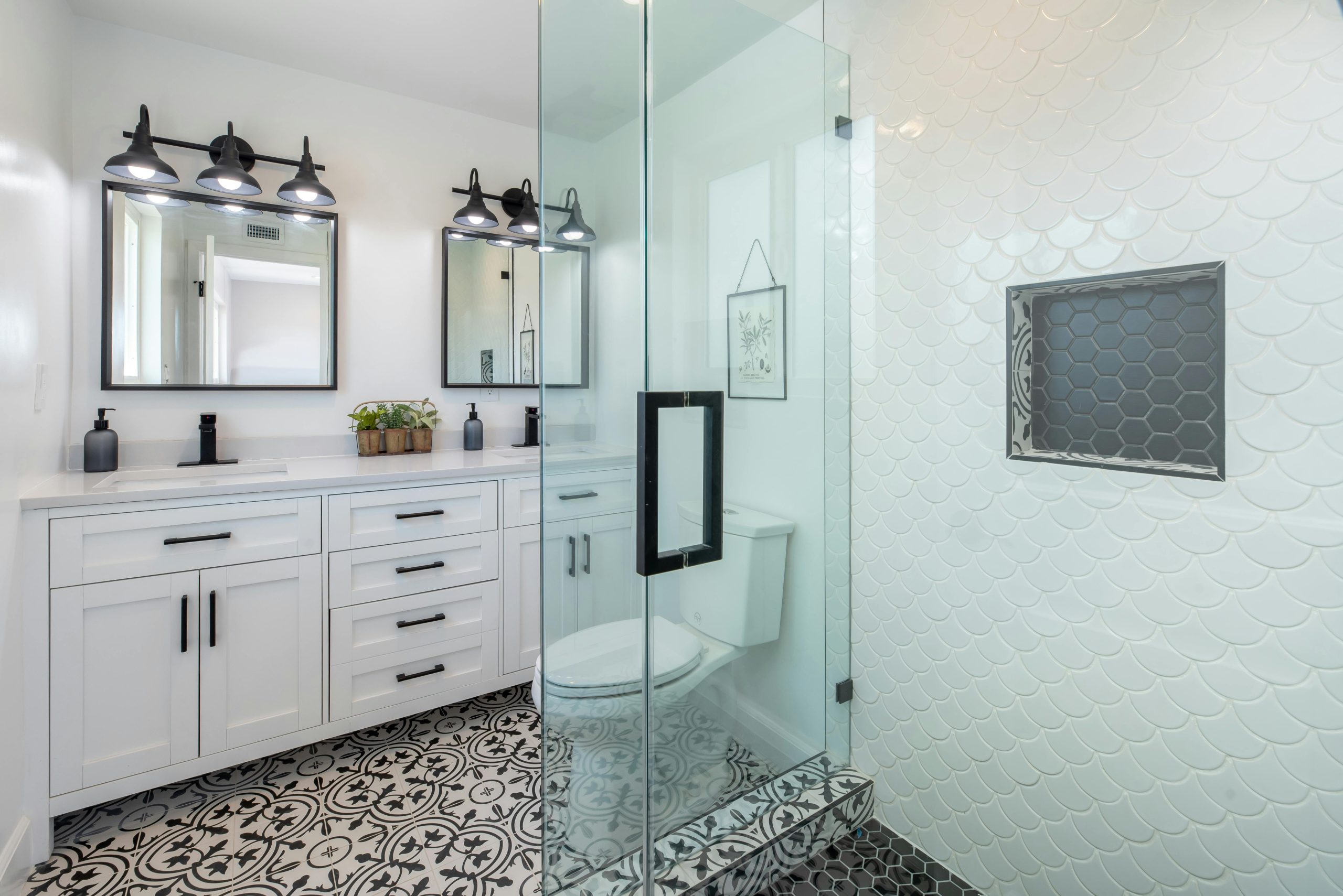 Bathroom renovation showcasing improved layout, custom cabinetry, and clean modern design