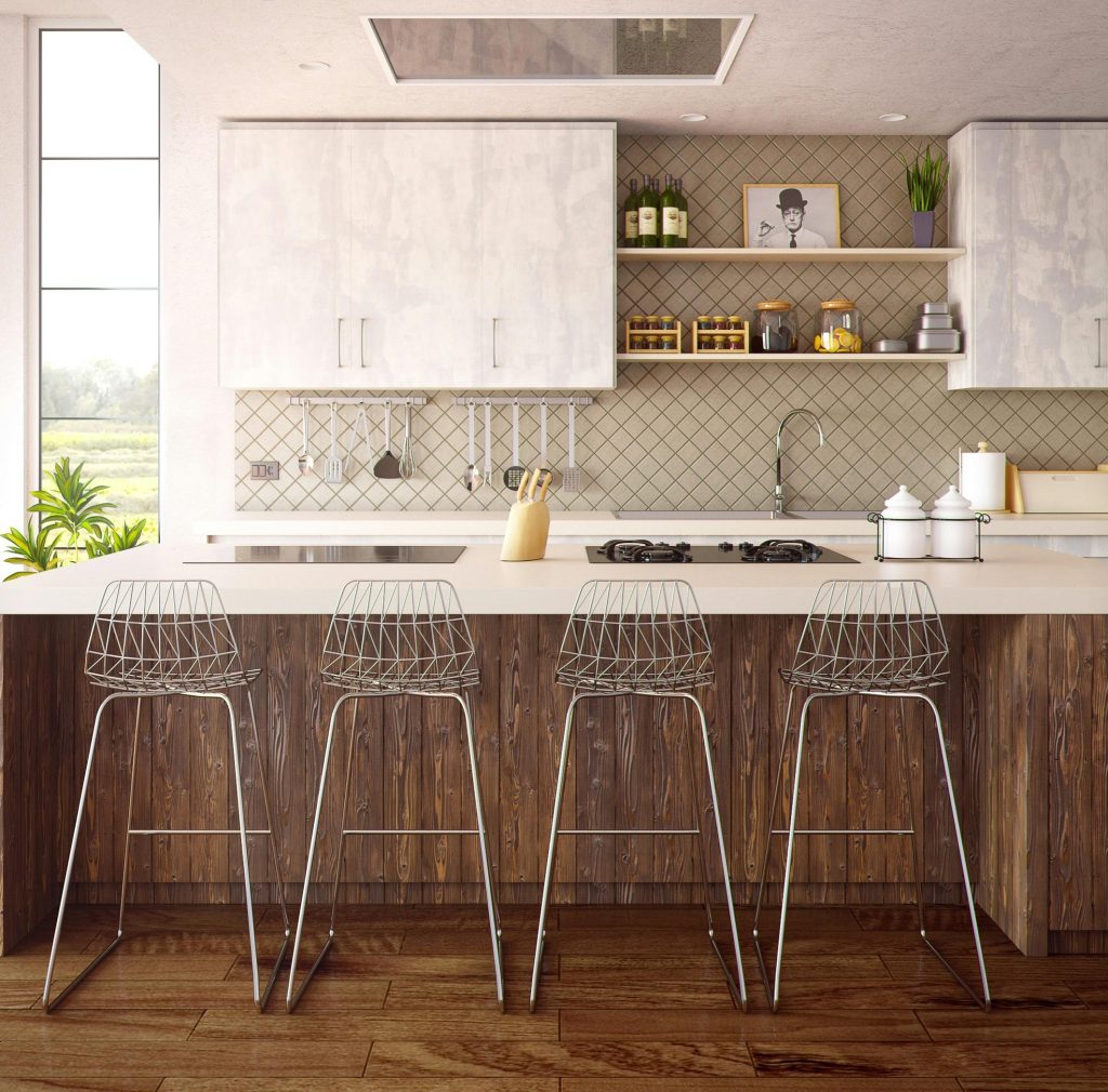 Modern invisible kitchen in Los Angeles featuring a wood-slat island, hidden induction technology, and minimalist white cabinetry.